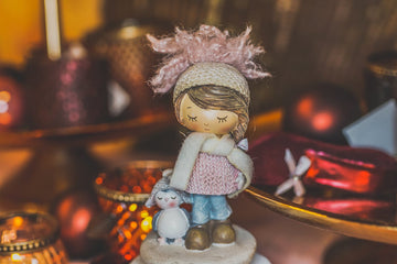 Girl and Penguin Figure
