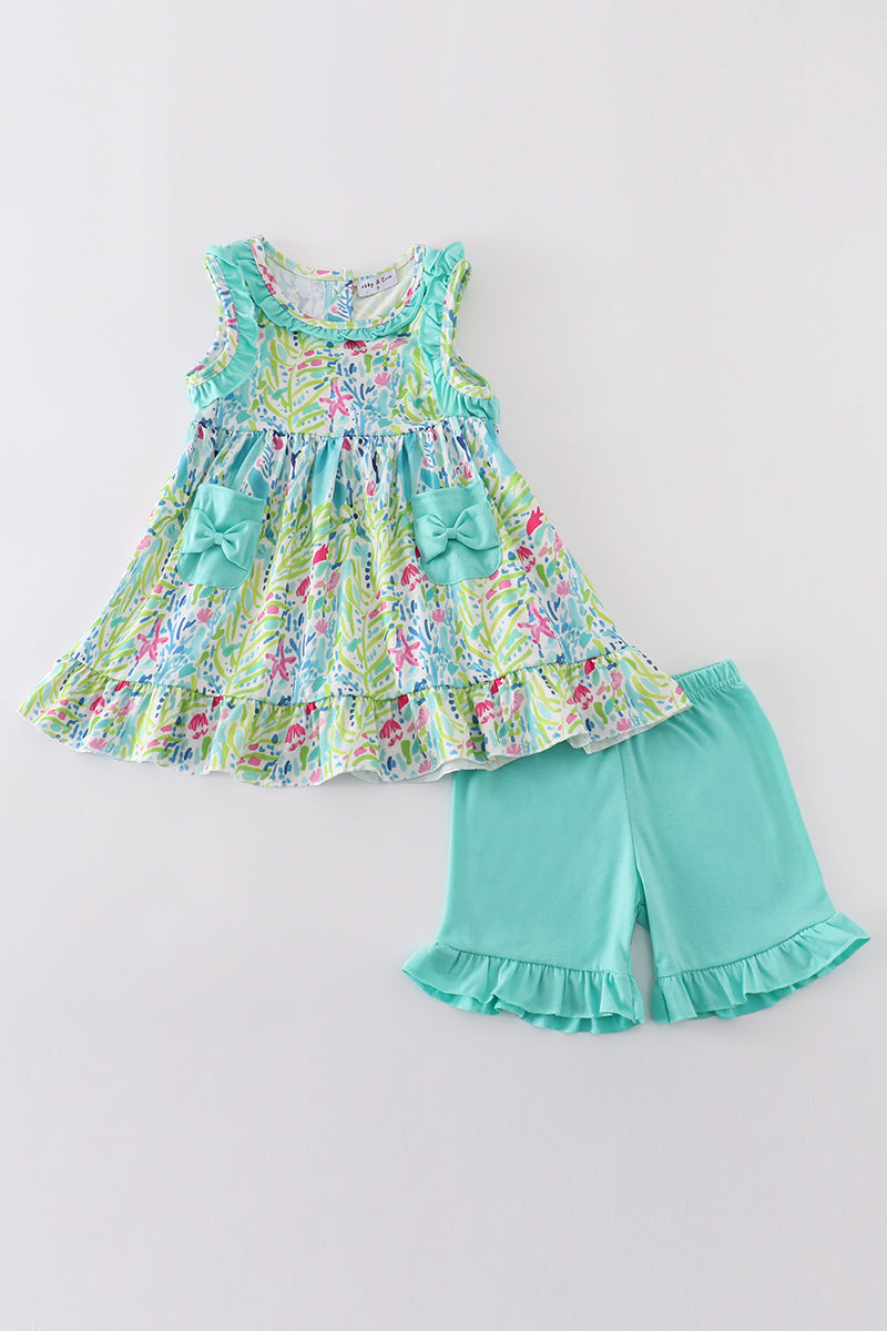 Colorful tropical breeze print set for kids, featuring palm leaves and vibrant flowers.