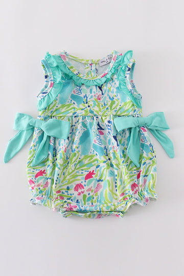 Tropical breeze print bubble romper with vibrant palm leaves, perfect for summer fun.