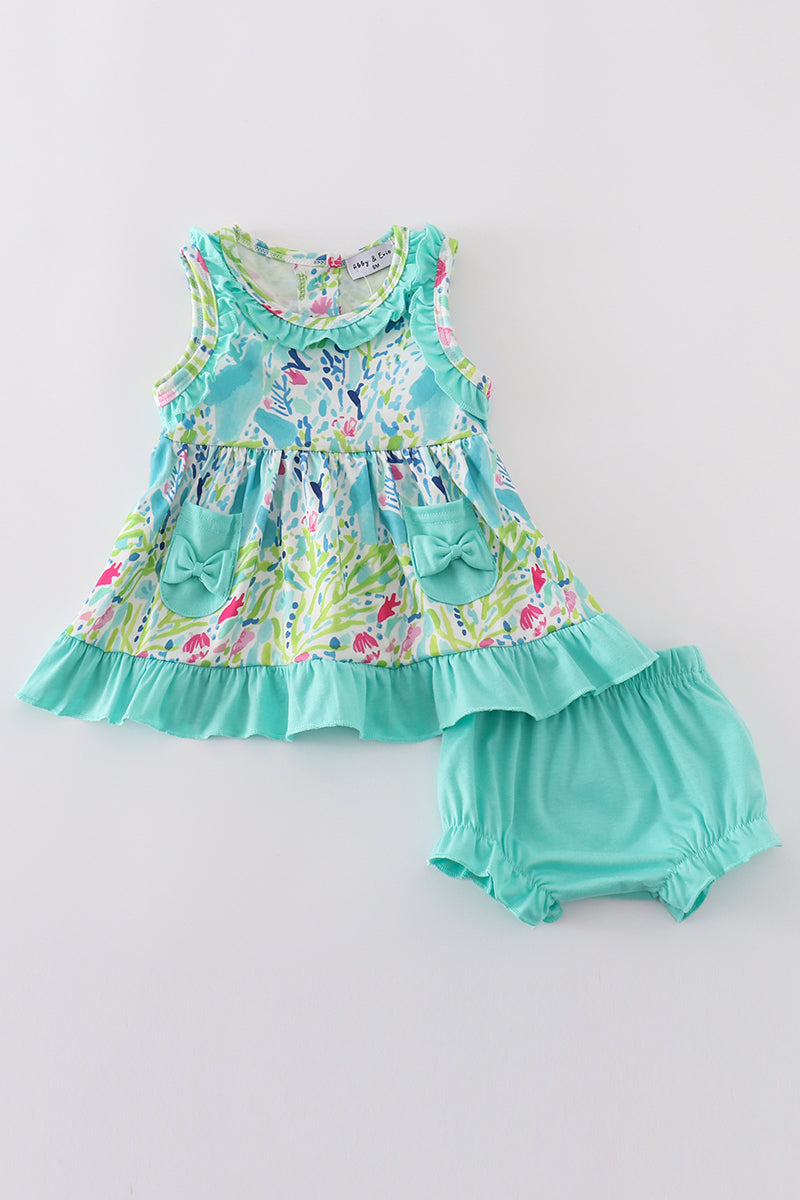 Bright, colorful bloomer set with tropical leaf and flower print, perfect for summer.