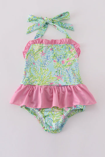 A vibrant, floral one-piece swimsuit for girls, perfect for sunny beach days.