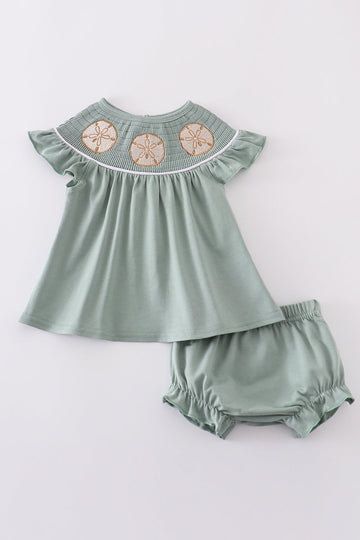 Sage green smocked bloomer set with sand dollar embroidery, perfect for summer.