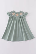 Sage green dress with sand dollar embroidery, perfect for beach outings.