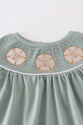 Sage green dress with sand dollar embroidery, perfect for beach outings.