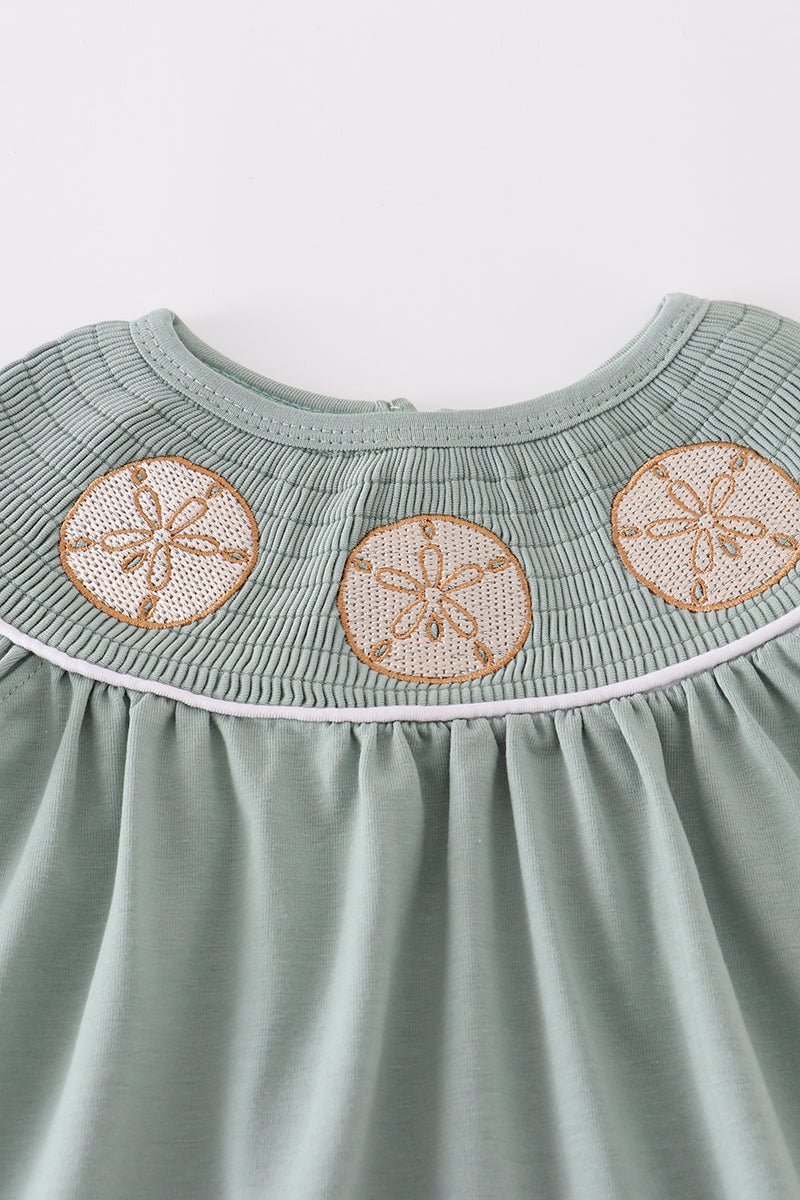 Sage green dress with sand dollar embroidery, perfect for beach outings.