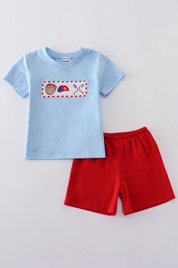 A charming blue smocked set with baseball embroidery, perfect for playful days.