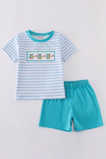 A charming boy's outfit with blue stripes and helicopter embroidery, perfect for playtime.