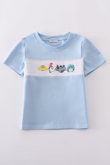 Blue Dr. Seuss smocked top with playful embroidery, perfect for kids.