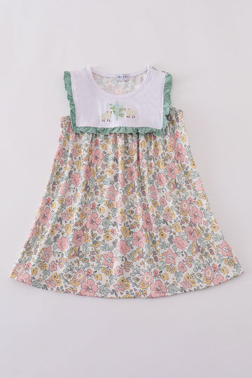 A charming floral sheep dress with cross embroidery, perfect for playful outings.