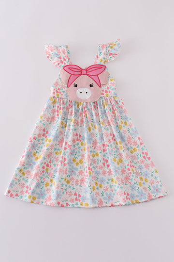 Pink floral dress with a cute pig applique, perfect for playful outings.