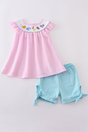 Pink seersucker top and shorts with cute animal embroidery, perfect for summer.