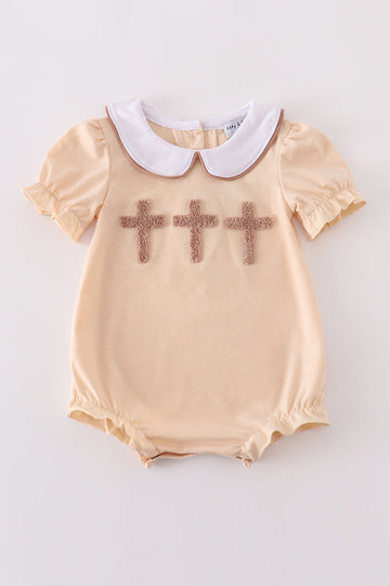 Cream cross french knot bubble romper with delicate embroidery, perfect for special occasions.