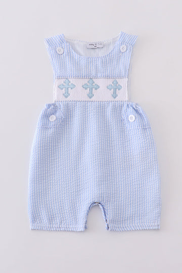 A charming blue smocked set with delicate cross embroidery, perfect for special occasions.