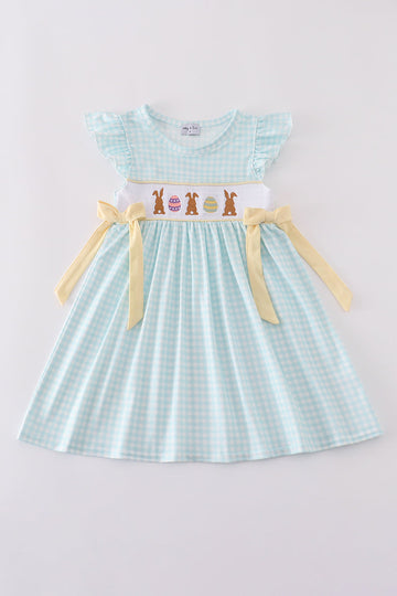 Blue smocked dress with adorable bunny embroidery, perfect for Easter celebrations.