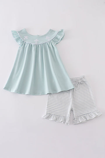 Blue cross embroidery set: cozy children’s outfit with charming cross-stitch pattern.