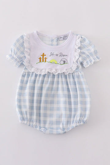 Blue plaid bubble romper with "He is Risen" embroidery, perfect for Easter.