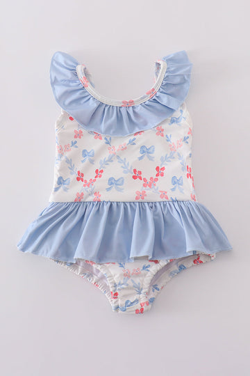 A charming blue lattice print swimsuit with a cute bow, perfect for summer fun.