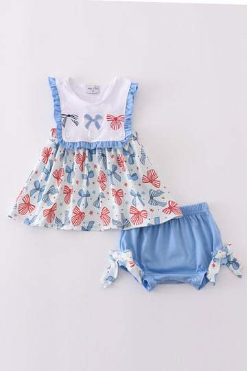 Adorable ruffle bloomer set with bow trellis print and embroidery.