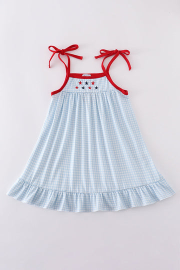 A charming gingham dress with star embroidery, perfect for playful adventures.