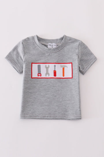 Grey tool embroidery top with playful patterns, perfect for everyday adventures.