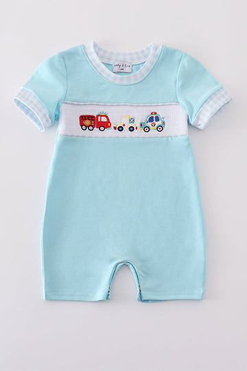 Blue romper with embroidered fire truck and police car, perfect for toddlers.