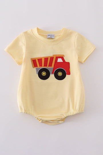 Bright yellow bubble romper with a playful truck applique, perfect for toddlers.