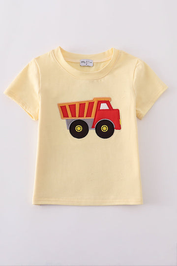 Bright yellow top for kids with a playful truck applique design.