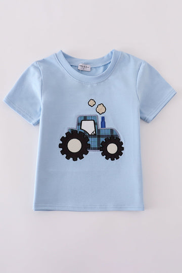 Blue long-sleeve top with cheerful yellow tractor applique, perfect for playful adventures.