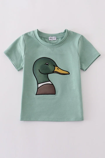 Green top with playful duck applique, perfect for kids' everyday adventures.