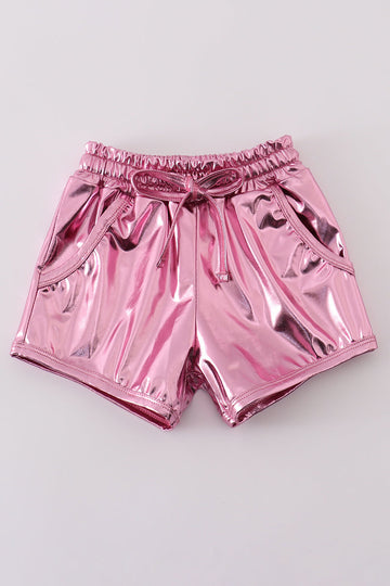 Pink laser shorts for kids with a vibrant, colorful geometric pattern.
