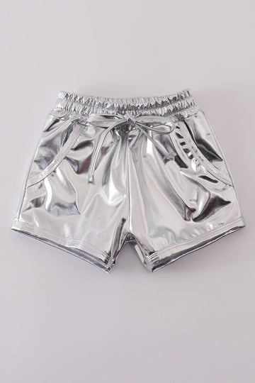 Shiny silver shorts with a fun, futuristic laser pattern, perfect for playtime.