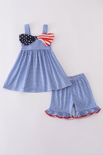 Adorable blue gingham shorts set with a playful flag bow detail.