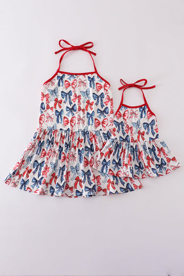 Matching mom and child tops with playful bow print, perfect for special outings.
