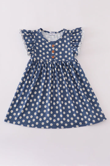 Navy dress with cheerful white daisy print, perfect for playful adventures.