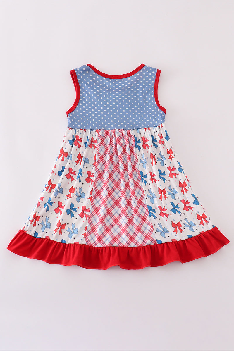 A charming blue dress with playful bow print and ruffled sleeves.
