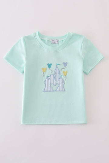 Mint green children's top featuring a whimsical castle applique, perfect for playtime.