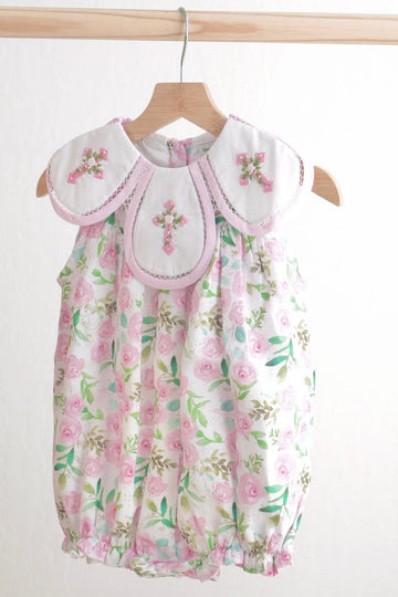 Pink bubble romper with Easter cross embroidery and floral pattern, perfect for girls.