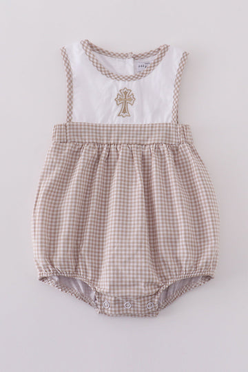 Adorable bubble romper with intricate cross embroidery, perfect for special occasions.