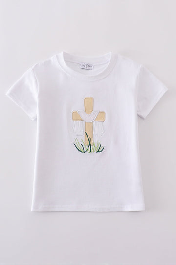 A cozy, white top with charming cross embroidery, perfect for playful adventures.