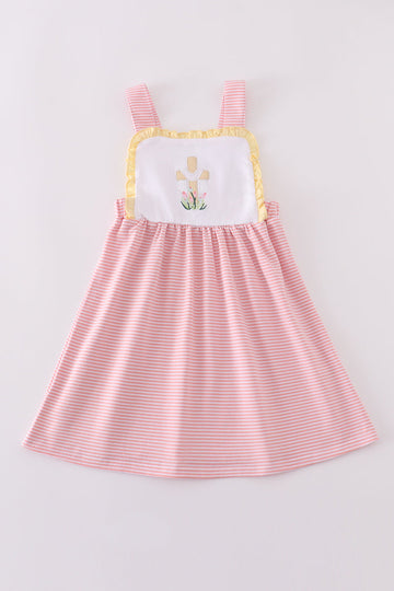 A charming pink dress with delicate cross embroidery, perfect for special occasions.