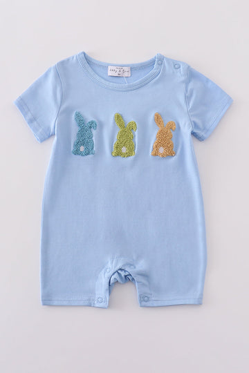 Premium blue romper with adorable bunny embroidery, perfect for playful spring days.