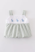 Premium white bubble romper with adorable bunny embroidery, perfect for springtime fun.
