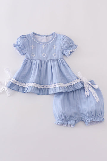 Cozy blue romper with charming cross embroidery, perfect for little ones.
