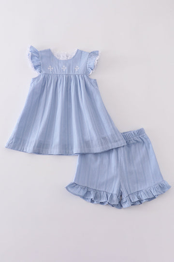 A cozy blue children's outfit with charming cross embroidery, perfect for special occasions.
