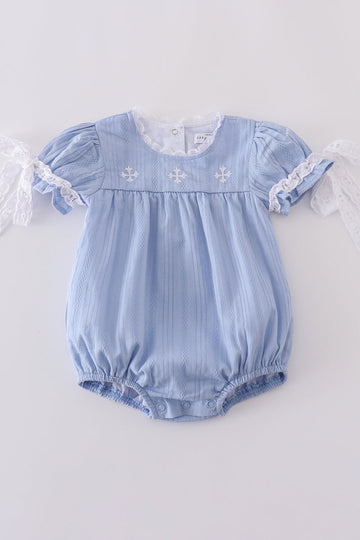 A cozy blue bubble romper with charming cross embroidery, perfect for playtime.