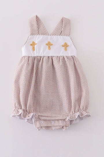 Premium brown bubble romper with charming cross embroidery, perfect for cozy playtime.