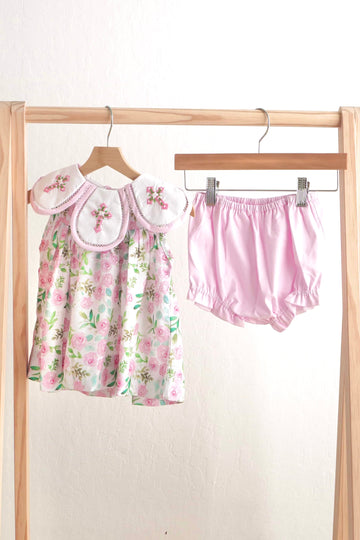 Pink Easter cross embroidery floral girl set with ruffled sleeves and pastel flowers.