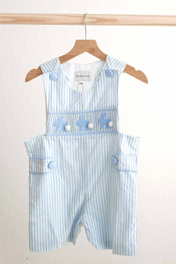 Blue Easter bunny hand-smocked jonjon with playful bunny pattern for boys.