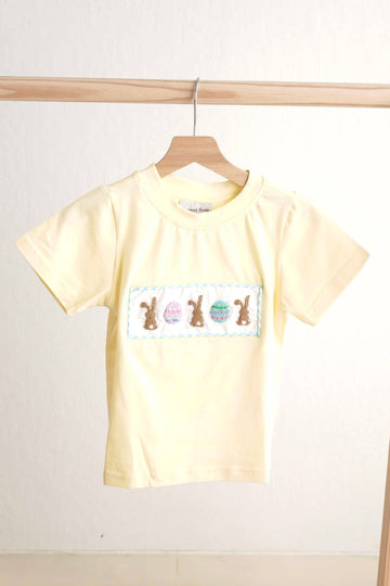 Mustard top with Easter bunny and egg design in French knot embroidery.