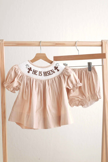 Khaki girl bloomer set with hand-smocked "He is Risen" design, perfect for Easter.